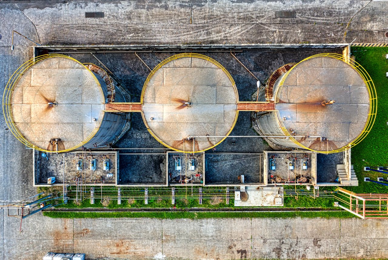 Drone view of storage tanks for oil products located in industrial refinery factory